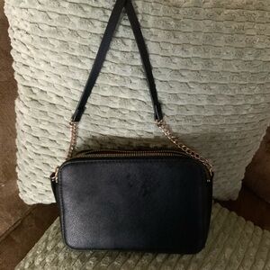 Black and Gold Crossbody Bag with Smooth Material and Gold Hardware
